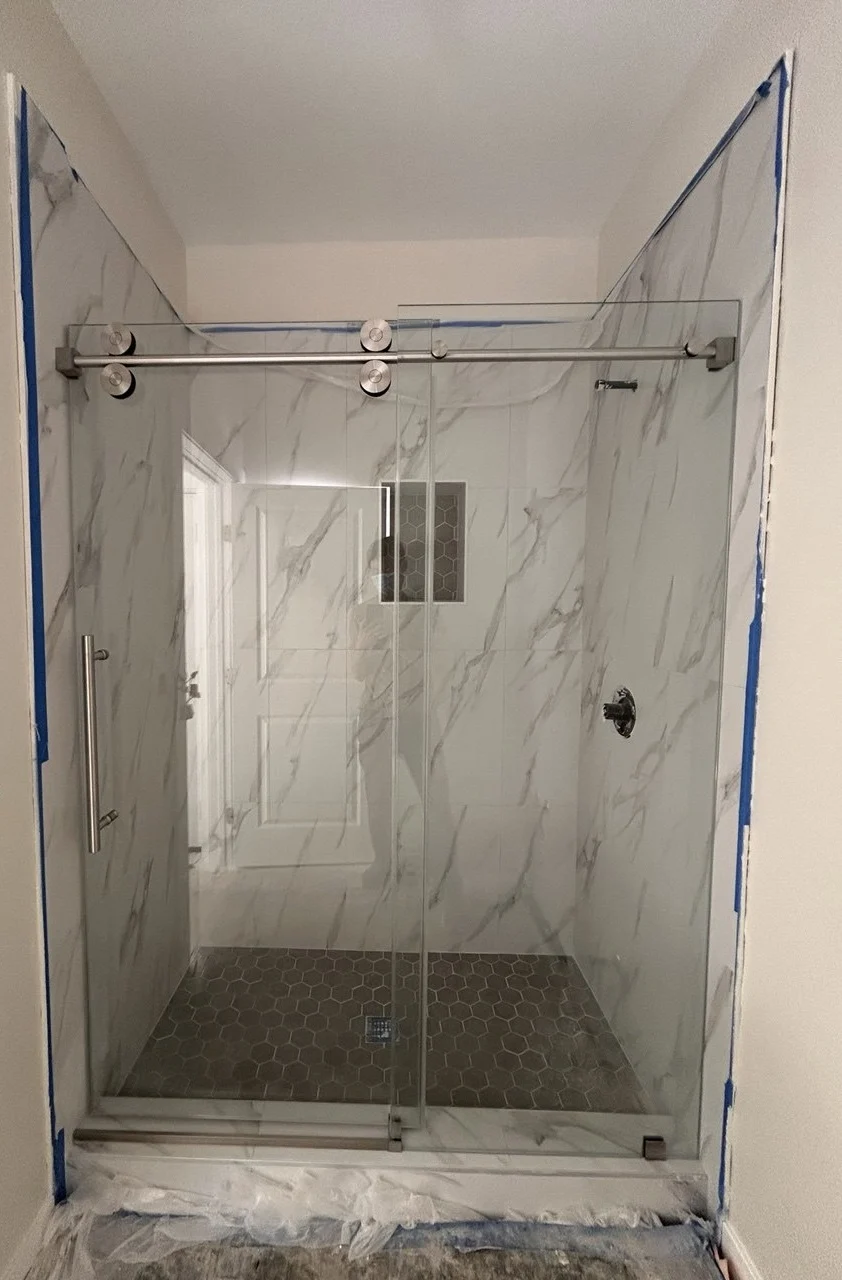 Completed single sliding frameless shower door installation in Chino, California