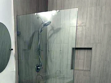 Standalone fixed glass panel for a walk-in shower in Covina