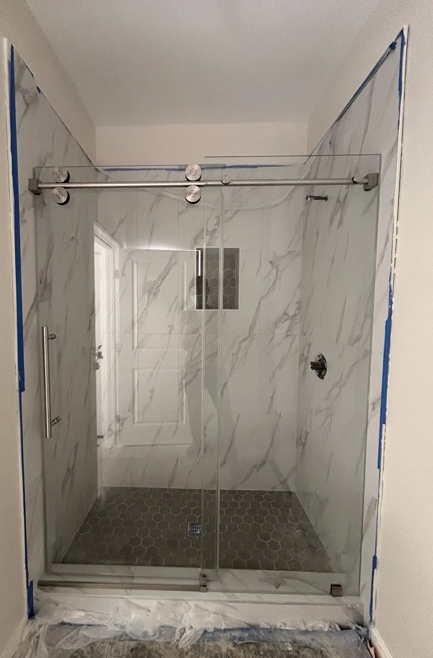 Complete single sliding frameless shower door installation in Chino California